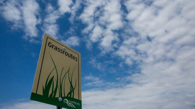Discover Our Grassroutes sign 
