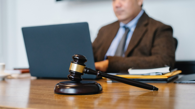 Man on computer with gavel 