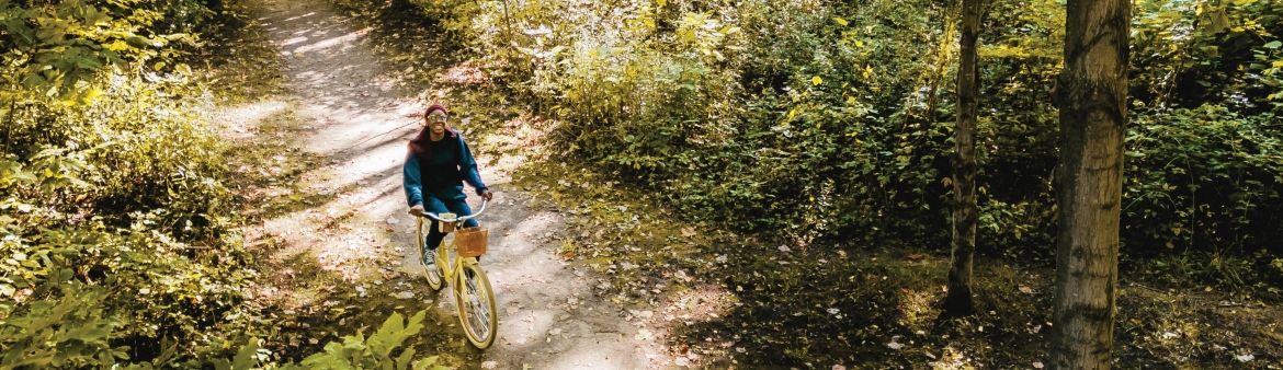 Person biking on path