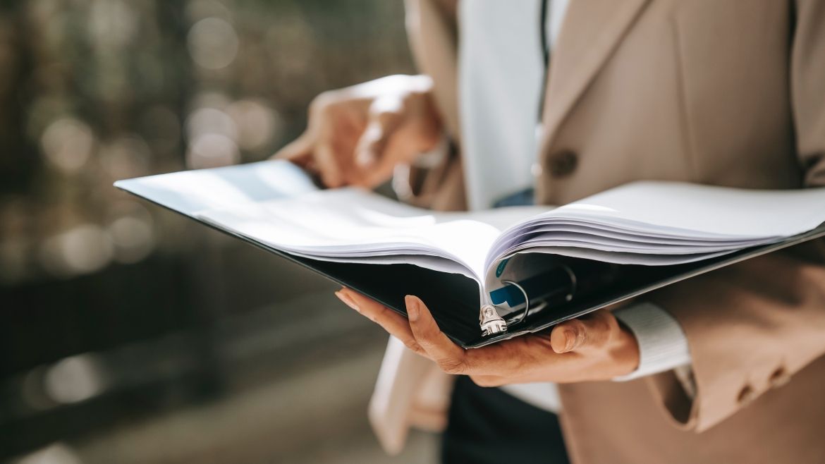 Person holding binder